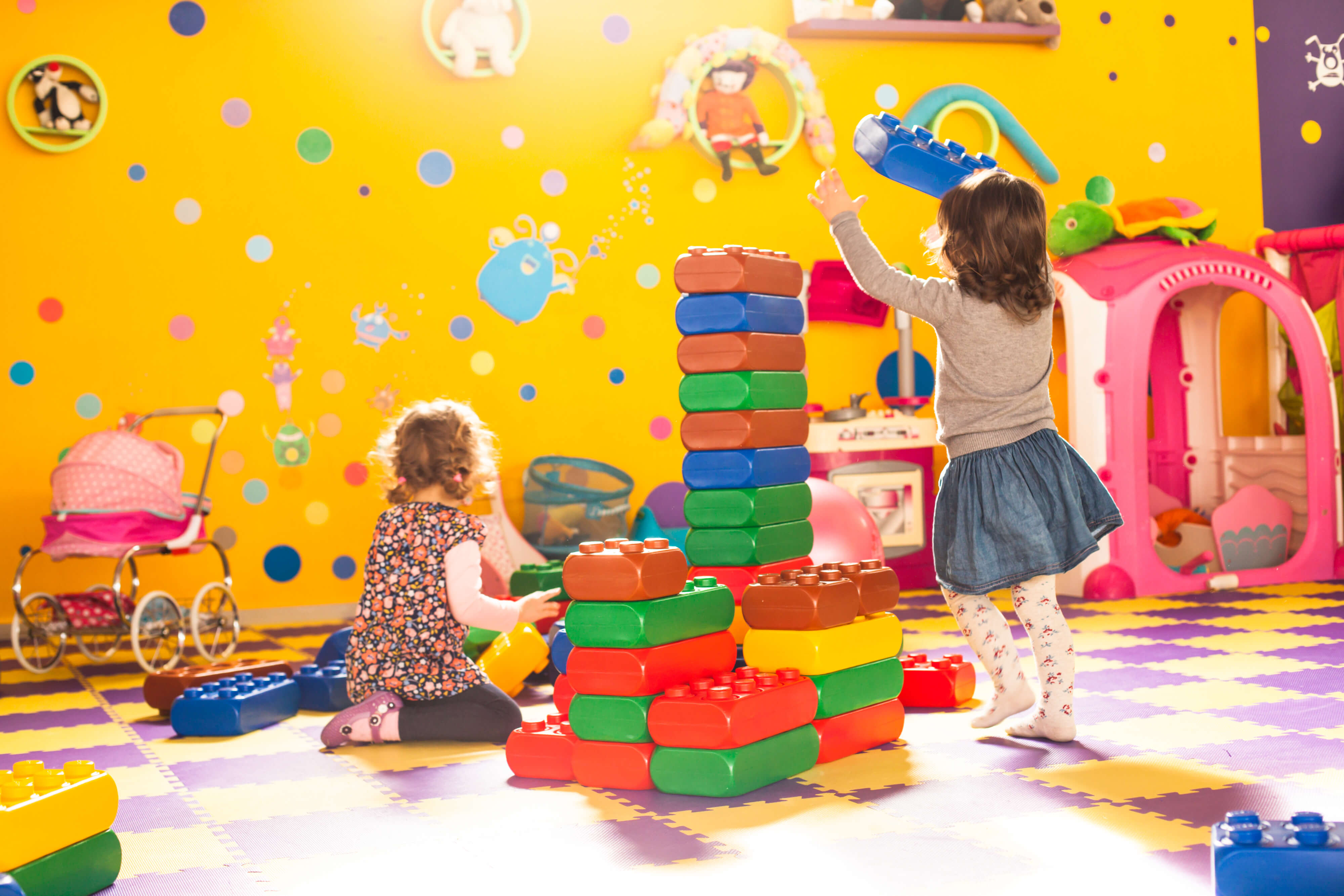 two girls play at childcare centre